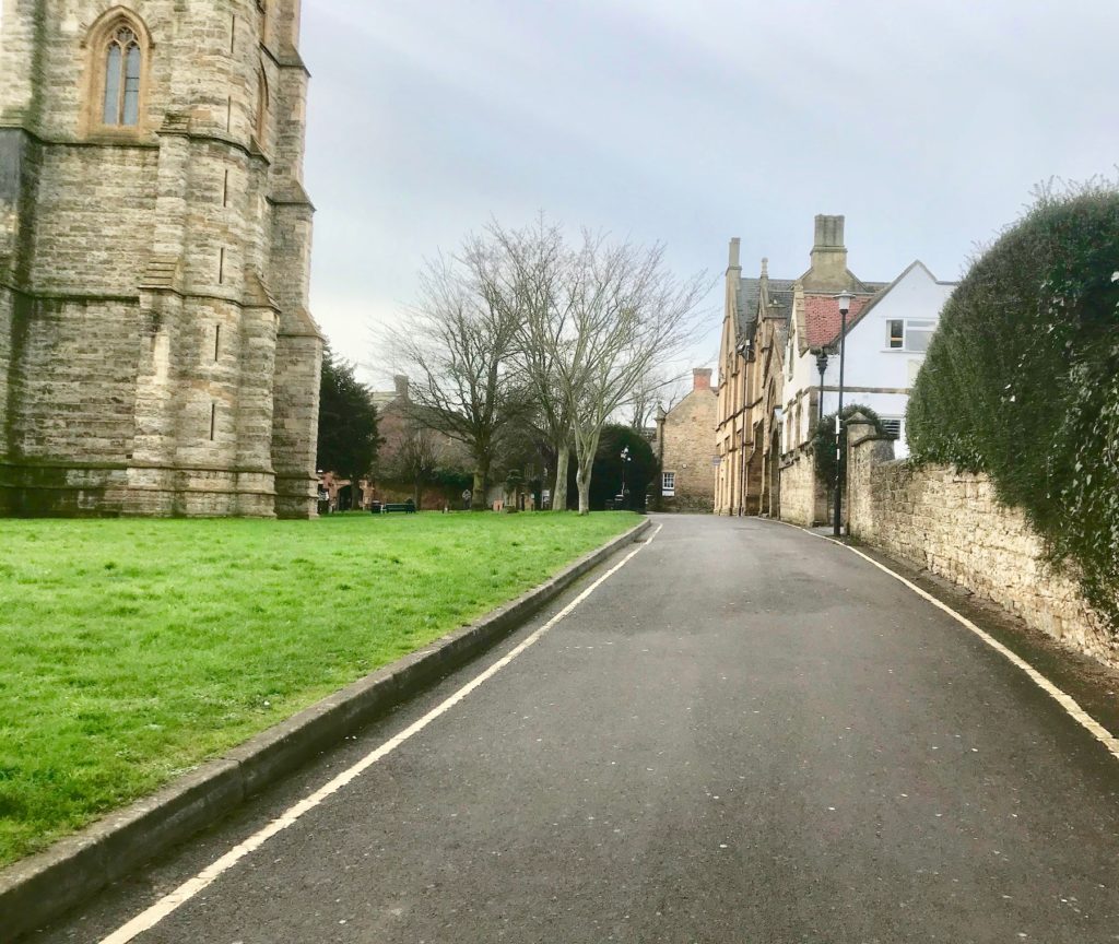 Church path, to the west of St John the Baptist church in Yeovil, Somerset. Looking south.