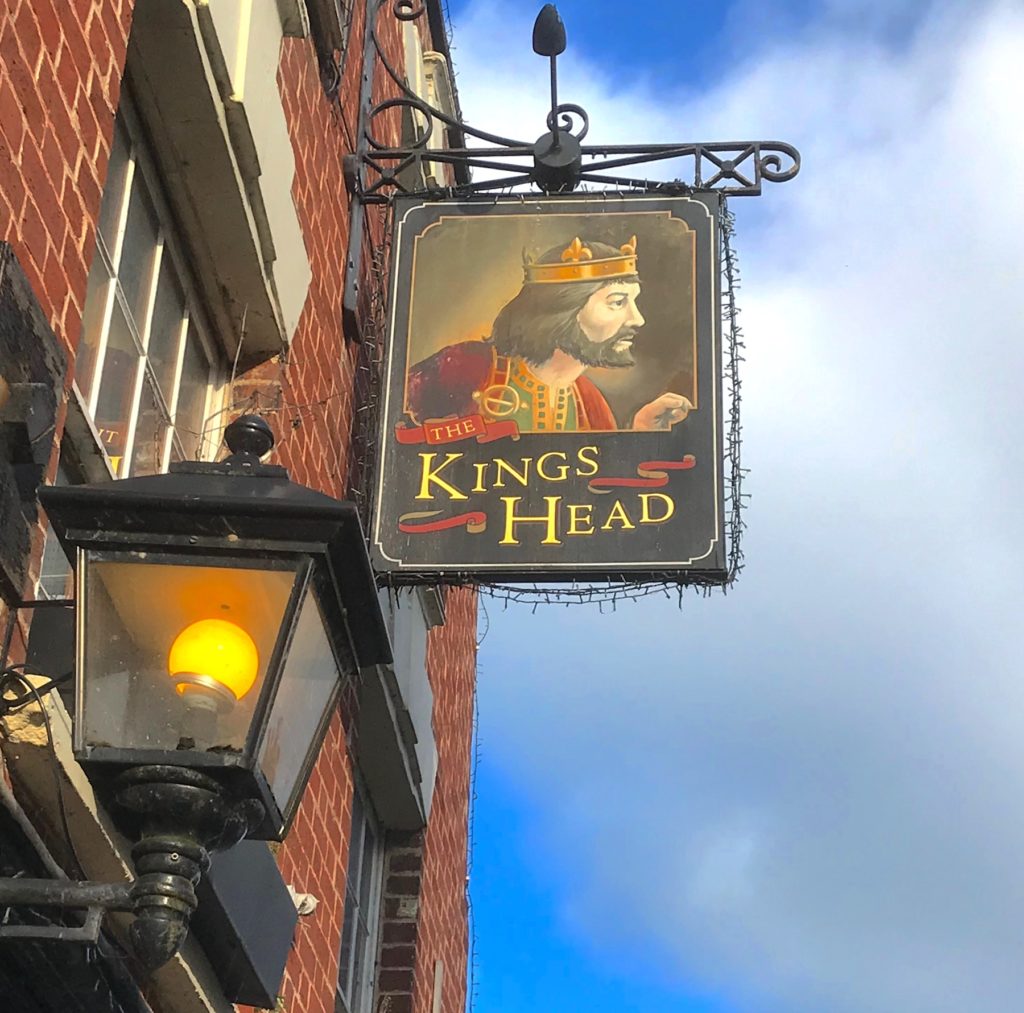 Wells, Somerset. A sign of a pub called The King's Head.